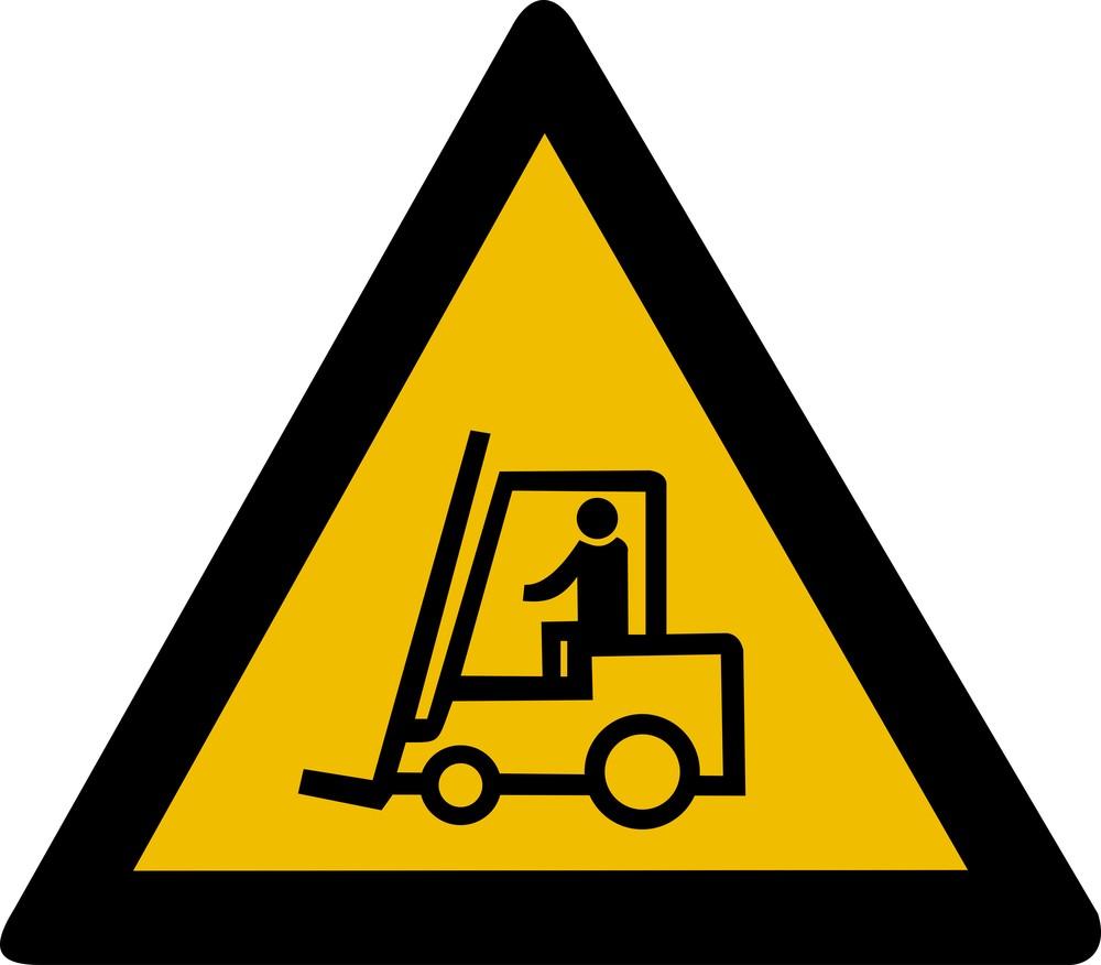 Yellow triangular forklift warning sign with a black forklift truck symbol, the standard sign posted where pedestrian routes cross forklift traffic