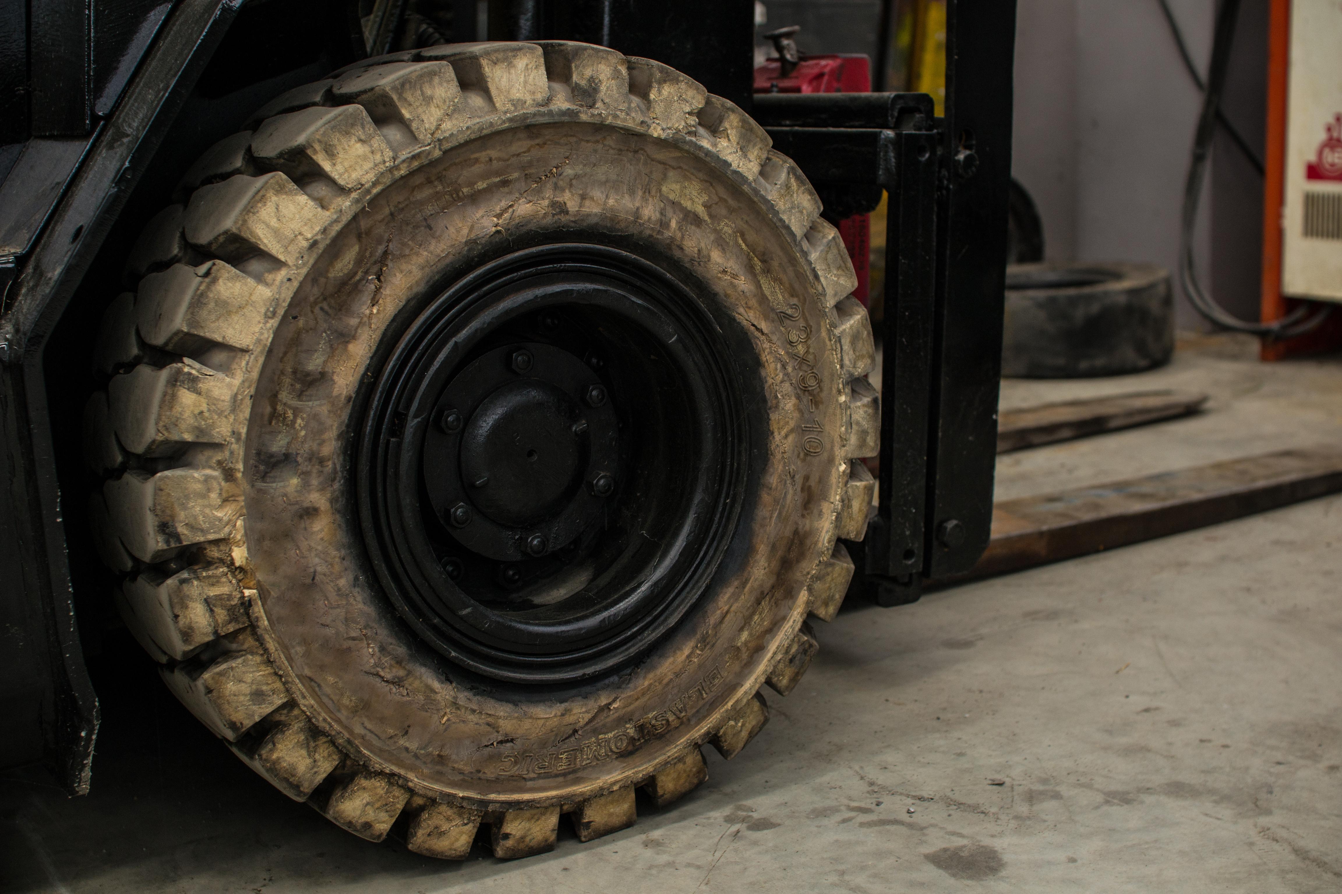 White non-marking solid tires in use on a forklift